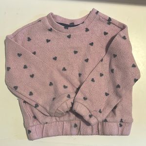 Toddler purple sweatshirt with hearts.